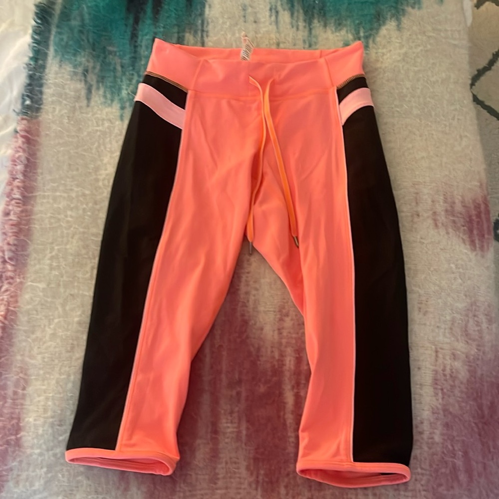 Vintage Lululemon cropped leggings. Bright peach, bubblegum pink, and black in S